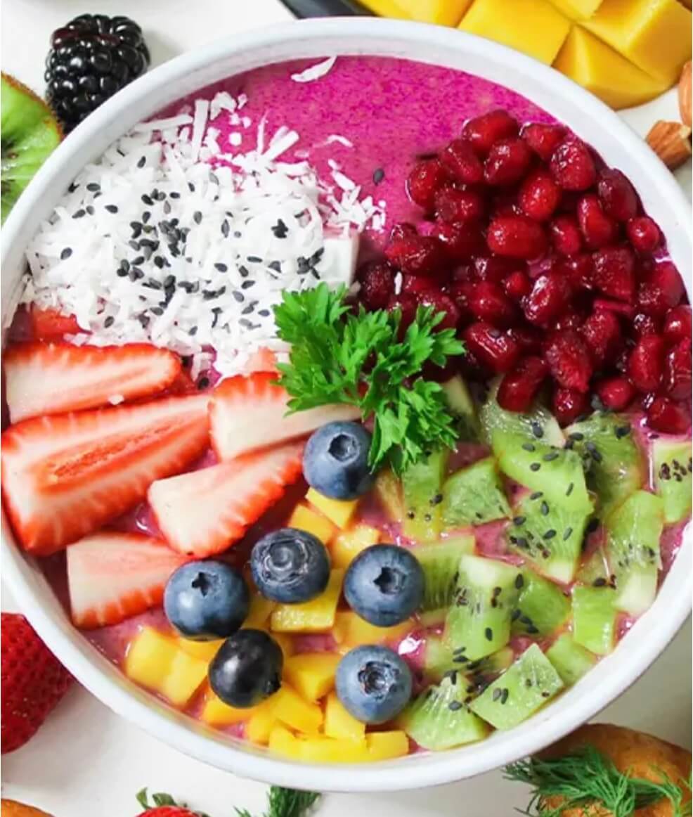 A plate of colourful fruit, including strawberries, blueberries and chia